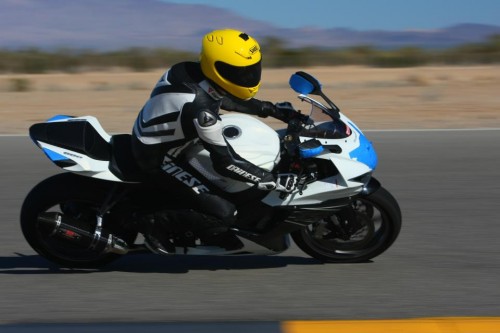 Fused CEO David Mckendrick racing motorcycle at racetrack